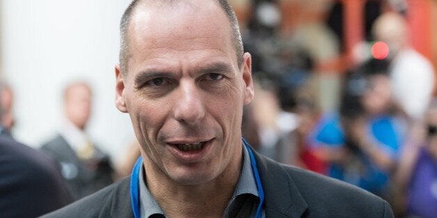 Greek Finance Minister Yanis Varoufakis waits for the International Monetary and Financial Committee (IMFC) family photo at the IMF/WB Spring Meetings in Washington, DC, on April 18, 2015. AFP PHOTO/NICHOLAS KAMM (Photo credit should read NICHOLAS KAMM/AFP/Getty Images)