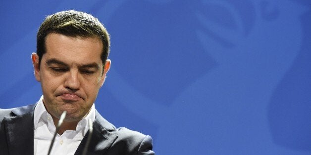 Greek Prime Minister Alexis Tsipras address a press conference following talks with the German Chancellor at the chancellery