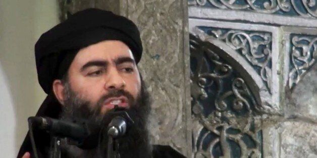 FILE - This file image made from video posted on a militant website Saturday, July 5, 2014, which has been authenticated based on its contents and other AP reporting, purports to show the leader of the Islamic State group, Abu Bakr al-Baghdadi, delivering a sermon at a mosque in Iraq during his first public appearance. Twelve years after the U.S. invaded Iraq to topple Saddam Hussein, the country is still mired in war. The latest phase: An existential battle against Islamic State group militants. For Iraqis, it feels like one long war, one that many blame on the United States. (AP Photo/Militant video, File)