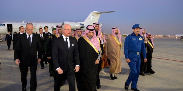 In this photo provided by the Saudi Press Agency, Sweden's King Carl XVI Gustaf is greeted by the Mayor of Riyadh, Prince Tur