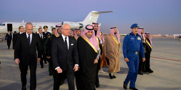 In this photo provided by the Saudi Press Agency, Sweden's King Carl XVI Gustaf is greeted by the Mayor of Riyadh, Prince Turki as he arrives to give his country's condolences for King Abdullah, Saturday, Jan. 24, 2015. World leaders and top dignitaries began arriving in Saudi Arabia to give their condolences following the death of King Abdullah, who died early Friday at 90 years-old after nearly two decades at the helm. (AP Photo/SPA)