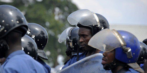 Burundian riot police stand guard during a demonstration against the president's bid for a third term on May 1, 2015, in Bujumbura. At least seven people have died and 66 others been wounded in nearly a week of clashes between police and protestors in the central African nation of Burundi, officials said on May 1. The unrest broke out after the ruling CNDD-FDD party designated President Pierre Nkurunziza as its candidate in the next presidential election, which is due to be held in the small central African nation on June 26. AFP PHOTO / SIMON MAINA (Photo credit should read SIMON MAINA/AFP/Getty Images)