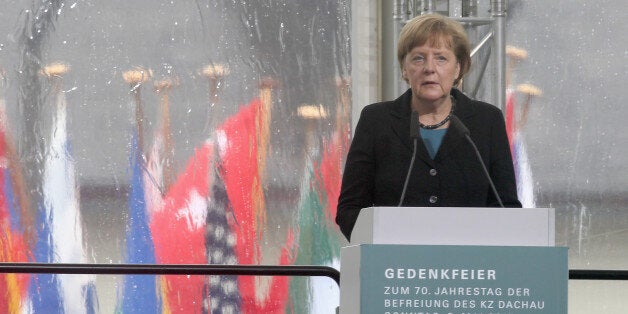 DACHAU, GERMANY - MAY 03: German Chancellor Angela Merkel speaks at a ceremony to commemorate the 70th anniversary of the liberation of the Dachau concentration camp at the memorial site on the grounds of the former concentration camp on May 3, 2015 in Dachau, Germany. Dachau was the first Nazi concentration camp and began operation in 1933 to hold political prisoners, though it later expanded to include Jews, common criminals and foreign nationals. It served mainly as a source of slave labour during World War II and included approximately 100 sub-camps spread across southern Germany and Austria. At least 30,000 inmates died before its liberation by U.S. troops in 1945. (Photo by Alexandra Beier/Getty Images)