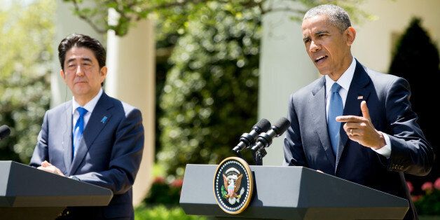 President Barack Obama, accompanied by Japanese Prime Minister Shinzo Abe speaks about the violence in Baltimore, following the death of a man from a spinal cord injury who was in police custody, Tuesday, April 28, 2015, during a news conference in the Rose Garden of the White House in Washington. (AP Photo/Andrew Harnik)