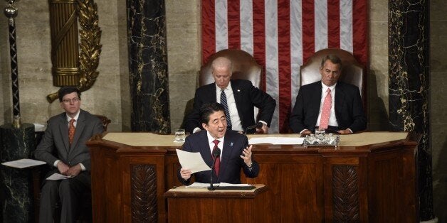 Japanese Prime Minister Shinzo Abe addresses a joint session of Congress at the US Capitol in Washington, DC, April 29, 2015. AFP PHOTO / SAUL LOEB (Photo credit should read SAUL LOEB/AFP/Getty Images)