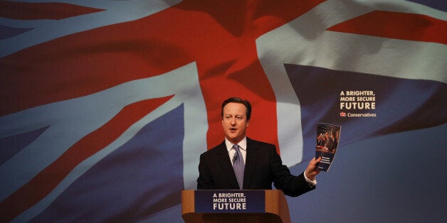 Britain's Prime Minister David Cameron gestures as he unveils the Conservative party manifesto, in Swindon, England, Tuesday April 14, 2015. Britain goes to the polls for a parliamentary election on Thursday May 7, 2015. (Peter Macdiarmid, Pool Photo via AP)