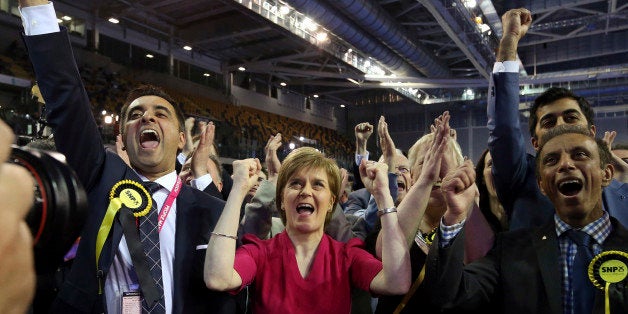First Minister of Scotland and Scottish National Party leader Nicola Sturgeon, center, celebrates with the results for her pa