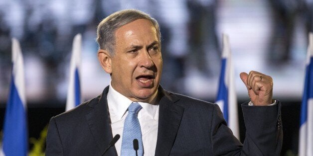 Israeli Prime Minister Benjamin Netanyahu delivers a speech during a ceremony honouring World War II veterans and marking the 70th anniversary of the Allied victory over Nazi Germany at the Armoured Corps Memorial and Museum at Latrun Junction near Jerusalem on May 7, 2015. AFP PHOTO / POOL / JACK GUEZ (Photo credit should read JACK GUEZ/AFP/Getty Images)