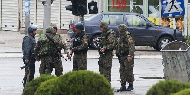 Police officers patrol in the streets of Kumanovo after armed incidents near the Kosovo border left four policemen injured on