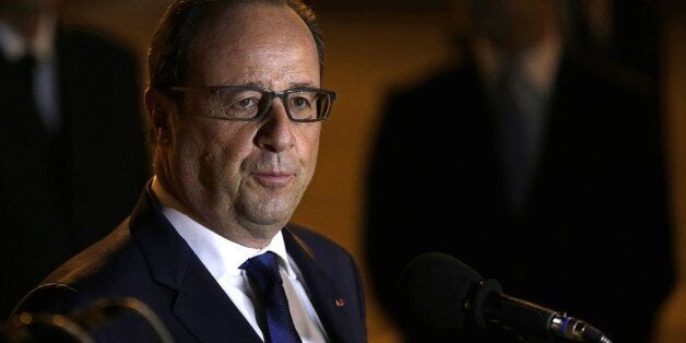 French President Francois Hollande speaks to reporters on the tarmac of Jose Marti Airport in Havana, Cuba, Sunday, May 10, 2015. Hollande is the first French president to ever visit communist Cuba, bringing along five ministers and two dozen business people.(AP Photo/Desmond Boylan)