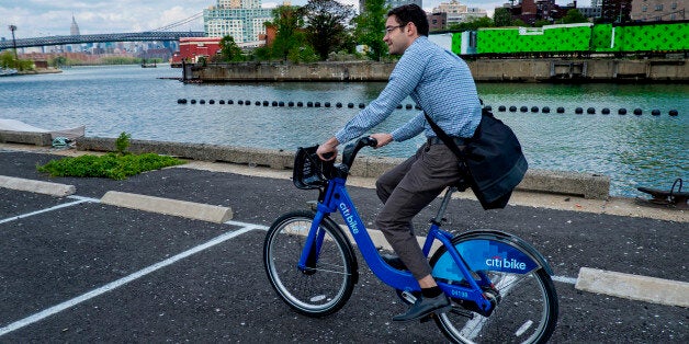 Alex Engel, with New York City Department of Transportation, rides a Bike Share bicycle during a demonstration of the program