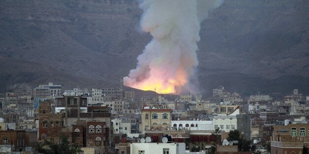 Smoke billows following an air-strike by Saudi-led coalition on May 11, 2015, in the capital Sanaa. The raid targeted an arms depot in the Mount Noqum area on the eastern outskirts of Sanaa, triggering several blasts, an AFP correspondent and witnesses said. AFP PHOTO / MOHAMMED HUWAIS (Photo credit should read MOHAMMED HUWAIS/AFP/Getty Images)