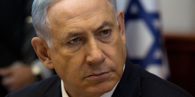 Israeli Prime Minister Benjamin Netanyahu looks on during the weekly cabinet meeting in his Jerusalem office, on April 19, 2015. AFP PHOTO / POOL / MENAHEM KAHANA (Photo credit should read MENAHEM KAHANA/AFP/Getty Images)