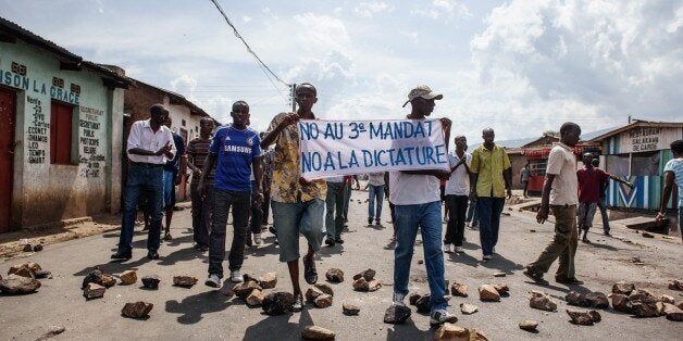 People demonstrate against Burundi President Pierre Nkurunziza's bid for the 3rd term in Nyakabiga neighborhood in Bujumbura on May 16, 2015. Burundi's government was Saturday accused of launching a campaign of reprisals and repression against independent media, the day after loyalist troops defeated an attempted coup against the central African nation's president. AFP PHOTO / JENNIFER HUXTA (Photo credit should read Jennifer Huxta/AFP/Getty Images)