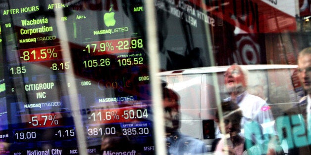 NEW YORK - SEPTEMBER 29: Passersby watch as the stock numbers are posted at the close of the market on the Nasdaq building in Times Square September 29, 2008 in New York City. U.S. stocks took a nosedive in reaction to the global credit crisis and as the U.S. House of Representatives rejected the $700 billion rescue package, 228-205. The Dow Jones Industrials recorded its biggest closing drop in history, as it fell 777 points in trading. (Photo by Rick Gershon/Getty Images)