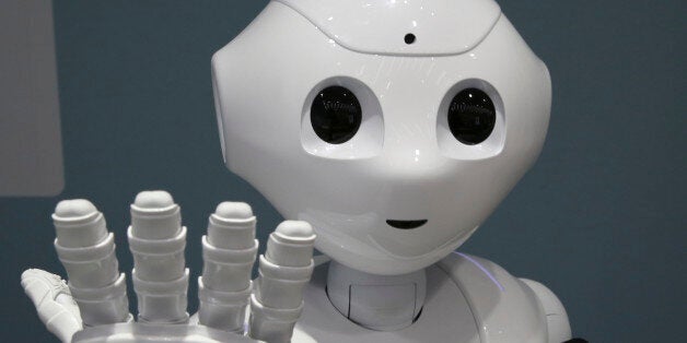 FILE - In this June 6, 2014 file photo, humanoid robot Pepper is on display at SoftBank mobile shop in Tokyo. Japanese mobile