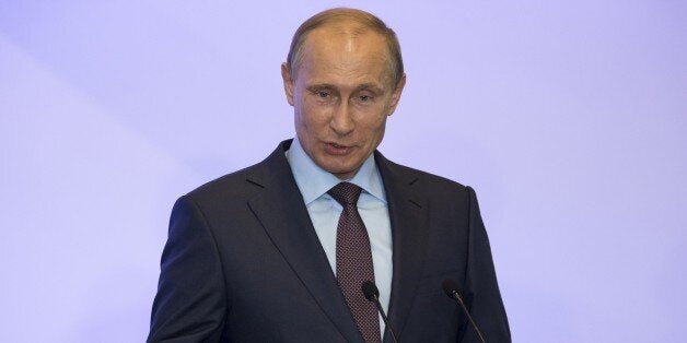 Russian President Vladimir Putin addresses members of Russian State duma fractions during a meeting in Mria sanatorium near Yalta, Crimea, on August 14, 2014. President Vladimir Putin said on Thursday that Russia should not 'fence itself off from the outside world' despite a plunge in East-West relations over the pro-Kremlin insurgency in Ukraine. AFP PHOTO / POOL / ALEXANDER ZEMLIANICHENKO (Photo credit should read ALEXANDER ZEMLIANICHENKO/AFP/Getty Images)