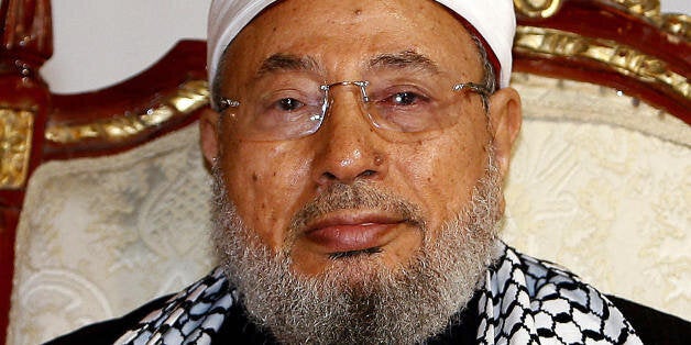 Qatar's Egyptian-born cleric Sheikh Youssef al-Qaradawi attends a protest against Israel over the recent Israeli attacks on the Gaza Strip, at the Qatar Sports Club in Doha, on January 1, 2009. Israel killed a Hamas leader today in the biggest blow yet to the Islamist group's command structure as dozens more air strikes on Gaza took the death toll from the six-day blitz to at least 420. AFP PHOTO/KARIM JAAFAR (Photo credit should read KARIM JAAFAR/AFP/Getty Images)