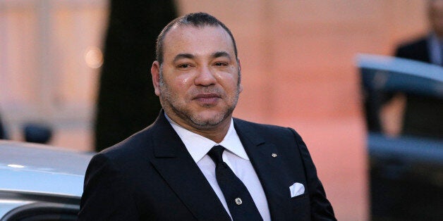 Morocco's King Mohammed VI poses as he leaves after a meeting with France's President Francois Hollande at the Elysee Palace, in Paris, France, Monday, Feb. 9, 2015. (AP Photo/Christophe Ena)