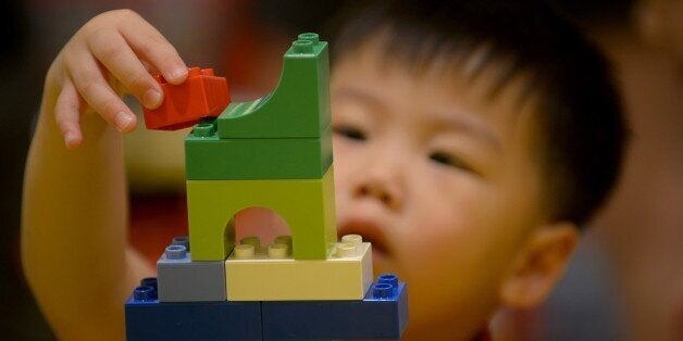 A child plays with Lego blocks during the opening of the brand's first certified store in Manila on May 12, 2015. Lego, the world's second-largest toy maker, said in February 2015 its annual revenue rose by 13 percent, boosted by its blockbuster movie and toys from its Star Wars and Friends ranges. AFP PHOTO / Jay DIRECTO (Photo credit should read JAY DIRECTO/AFP/Getty Images)