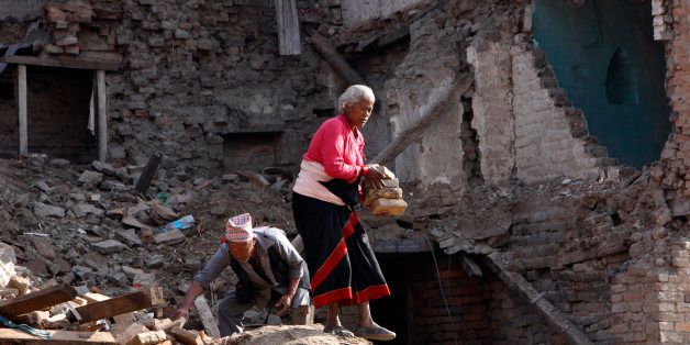 Kanchan Khyamali, 73, and his wife Krishna Kumari Khyamali collect bricks from damaged buildings in Bhaktapur, Nepal, Thursday, May 14, 2015. On April 25, a magnitude-7.8 earthquake killed thousands of people, injured tens of thousands more and left hundreds of thousands homeless. Then, just as the country was beginning to rebuild, a magnitude-7.3 earthquake battered it again. (AP Photo/Bikram Rai)