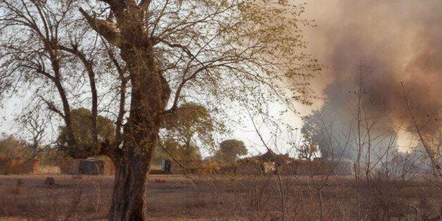 In this photo made available by the Nigerian Military taken Tuesday, April 28, 2015, a pall of smoke hangs over an Islamic extremist camp, after it was allegedly destroyed by Nigerian military personnel during a attack on Islamic extremists in the Sambisa Forest, Nigeria. Nigeria's military rescued 234 more girls and women from a Boko Haram forest stronghold in the country's northeast, an announcement on social media said Saturday, May 2, 2015. (Nigerian Military via AP)