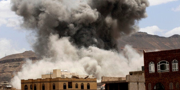 Smoke rises after a Saudi-led airstrike targeted a military base in Sanaa, Yemen, Sunday, May 24, 2015. Fighting raged on in