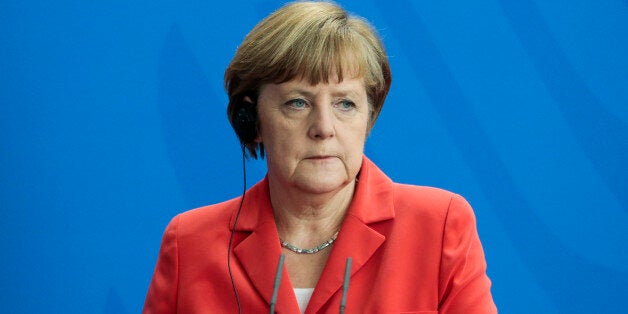 German Chancellor Angela Merkel attends a news conference after a meeting with French President Francois Hollande at the chancellery, in Berlin, Germany, Tuesday, May 19, 2015. (AP Photo/Markus Schreiber)