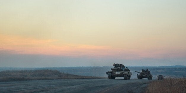 Tanks of pro-Russian separatists ride on the road from Donetsk to Novoazovsk, Mariupol district on February 24, 2015. Foreign
