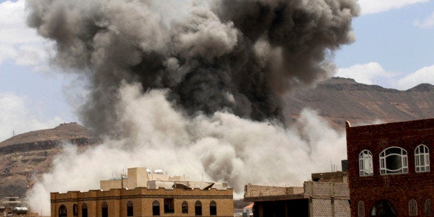 Smoke rises after a Saudi-led airstrike targeted a military base in Sanaa, Yemen, Sunday, May 24, 2015. Fighting raged on in
