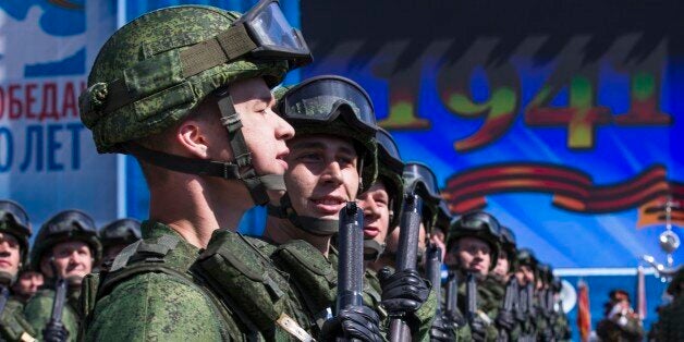 Russian soldiers march during the Victory Parade marking the 70th anniversary of the defeat of the Nazis in World War II, in Red Square in Moscow, Russia, Saturday, May 9, 2015. (AP Photo/Alexander Zemlianichenko, Pool)