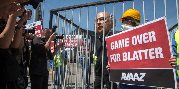 IMAGE DISTRIBUTED FOR AVAAZ - An Avaaz Stunt in front of the Fifa General Meeting at the Hallenstadion on Thursday, May 28, 2015, in Zurich, Switzerland. Protesters from the global campaign movement Avaaz demanded the resignation of Sepp Blatter over the FIFA corruption scandal and rights abuses of World Cup construction workers in Qatar. (Gian Vaitl/AP Images for Avaaz)