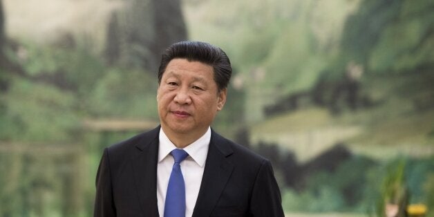 Chinese President Xi Jinping awaits the arrival of US Secretary of State John Kerry for a meeting at the Great Hall of the People in Beijing on May 17, 2015. Kerry is on a two-day visit to China. AFP PHOTO / POOL / SAUL LOEB (Photo credit should read SAUL LOEB/AFP/Getty Images)