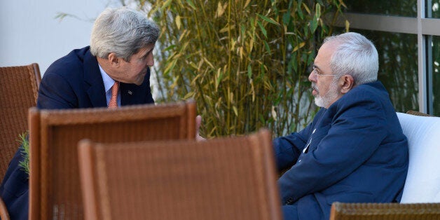 U.S. Secretary of State John Kerry, left, talks with Iranian Foreign Minister Mohammad Javad Zarif, in Geneva, Switzerland, Saturday, May 30, 2015. Top U.S. and Iranian diplomats are gathering in Geneva this weekend, hoping to bridge differences over a nuclear inspection accord and economic sanctions on Tehran. (AP Photo/Susan Walsh, Pool)