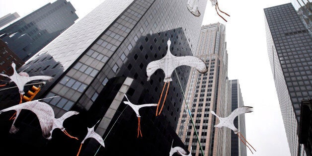 Bird-shaped kites are held in the air as demonstrators make their way down Sixth Avenue during the People's Climate March Sunday, Sept. 21, 2014 in New York. The march, along with similar gatherings scheduled in other cities worldwide, comes two days before the United Nations Climate Summit, where more than 120 world leaders will convene for a meeting aimed at galvanizing political will for a new global climate treaty by the end of 2015. (AP Photo/Jason DeCrow)