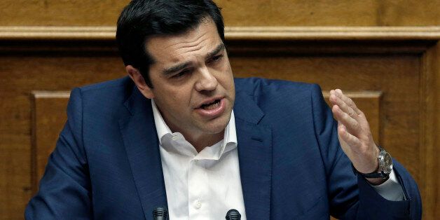 Greece's Prime Minister Alexis Tsipras gives his speech during an emergency Parliament session in Athens, on Friday, June 5, 2015. Tsipras said that his government cannot accept "irrational" proposals like one made this week by the institutions overseeing Greece's bailout, and insisted any solution must also include some form of debt relief.(AP Photo/Petros Giannakouris)