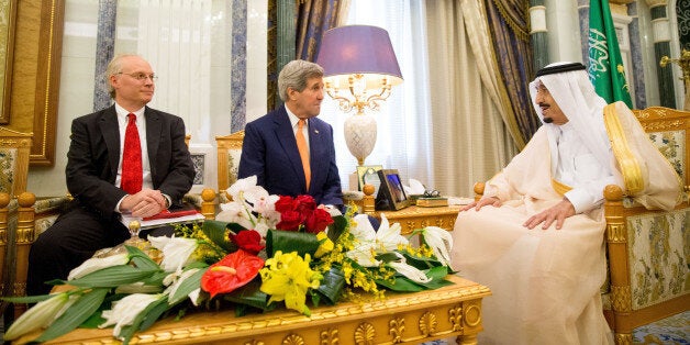 U.S. Secretary of State John Kerry, center, accompanied by Timothy Lenderking, US charge dâaffaires, left, meet with Saudi Arabia's King Salman at the Royal Court, in Riyadh, Saudi Arabia, Thursday, May 7, 2015. Kerry sought to secure a pause in Yemen's war after he arrived to Saudi Arabia to meet with the king and other top officials, citing increased shortages of food, fuel and medicine that are adding to a crisis that already has neighboring countries bracing for a mass exodus of refugees. (AP Photo/Andrew Harnik, Pool)