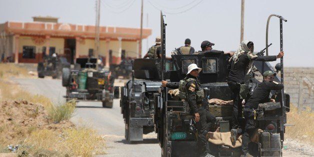 Iraqi forces deploy in the city of Baiji, north of Tikrit, as they advance against the Islamic State jihadist group to try to retake the strategic town for a second time, on June 8, 2015. Baghdad regained control of Baiji -- located on the road to IS hub Mosul and near the country's largest oil refinery -- last year, but subsequently lost it again. AFP PHOTO/AHMAD AL-RUBAYE (Photo credit should read AHMAD AL-RUBAYE/AFP/Getty Images)