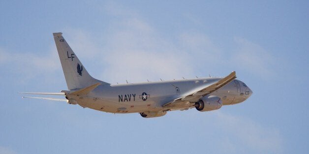 A United States Navy Boeing P-8 Poseidon takes off from Perth International Airport as part of the search to locate missing Malaysia Airways Flight MH370 on April 15, 2014. A mini-sub hunting for Malaysian jet MH370 prepared to make a second mission to the remote Indian Ocean seabed on April 15 after aborting its first search as it encountered water deeper than its operating limits, officials said. AFP PHOTO / Richard Wainwright / POOL (Photo credit should read RICHARD WAINWRIGHT/AFP/Getty Images)