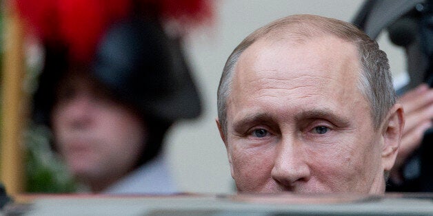 Russia President Vladimir Putin leaves the Vatican at the end of a private audience with Pope Francis, Wednesday, June 10, 2015. Russian President Vladimir Putin was meeting Wednesday with Italian officials and Pope Francis as the U.S. sought to encourage the Vatican to join the West in condemning Moscow's actions in Ukraine. (AP Photo/Andrew Medichini)