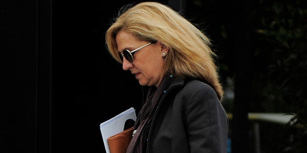 FILE - In this April 5, 2013 file photo, Spain's Princess Cristina as she walks toward her office in Barcelona, Spain. Spainâ