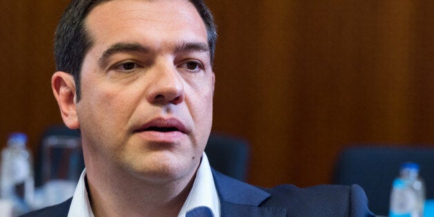 Greek Prime Minister Alexis Tsipras waits for the start of a round table meeting at the EU-CELAC summit in Brussels on Wednesday, June 10, 2015. Greece's prime minister was hoping to meet with the leaders of Germany and France in Brussels Wednesday, in the latest effort to break a bailout negotiation deadlock that has revived fears his country could default and drop out of the euro. (AP Photo/Geert Vanden Wijngaert)