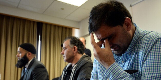 BRADFORD, ENGLAND - JUNE 16: Mohammed Shoaib (R) husband of Khadiji Bibi Dawwood and Akhtar Iqbal husband of Surgra Dawood and solicitor Balaal Hussain Khan (L) speak to media at the Bradford Hotel on June 16, 2015 in Bradford, England. Three sisters from Bradford are feared to have travelled to Syria with their nine children after going on a pilgrimage to Saudi Arabia. (Photo by Nigel Roddis/Getty Images)