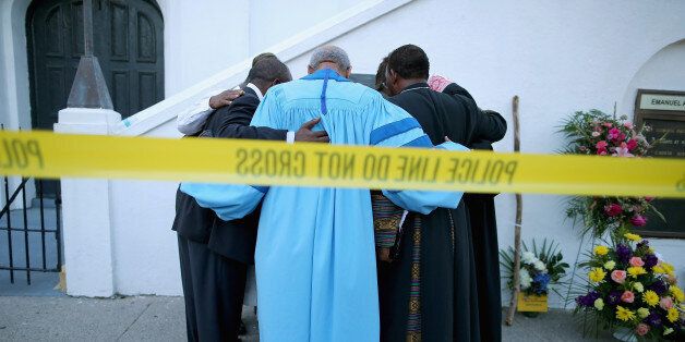 CHARLESTON, SC - JUNE 18: The Rev. Sidney Davis and other area pastors pray together outside the historic Emanuel African Methodist Episcopal Church June 18, 2015 in Charleston, South Carolina. Dylann Storm Roof, 21, of Lexington, South Carolina, who allegedly attended a prayer meeting at the church for an hour before opening fire and killing three men and six women last night, was arrested today. Among the dead is the Rev. Clementa Pinckney, a state senator and a pastor at Emanuel AME, the oldest black congregation in America south of Baltimore, according to the National Park Service. (Photo by Chip Somodevilla/Getty Images)
