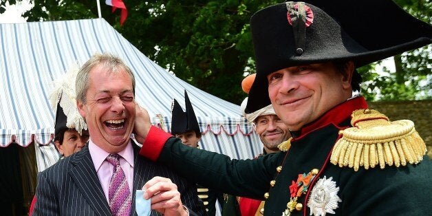 French lawyer Franck Samson, dressed as Napoleon Bonaparte (R) pulls the ear of UK Independence Party (UKIP) leader Nigel Farage at Napoleon Bonaparte headquarters during the celebrations of the 200th anniversary of The Battle of Waterloo in Waterloo, on June 18, 2015. European royals and diplomats gathered in Belgium on Thursday to mark the 200th anniversary of the Battle of Waterloo, a turning point for the continent which still touches a nerve and stirs national passions. 'Waterloo, the folly and the grandeur. The horror and the genius. The tragedy and then the hope,' Belgian Prime Minister Charles Michel said in an opening address under leaden skies. AFP PHOTO/Emmanuel Dunand (Photo credit should read EMMANUEL DUNAND/AFP/Getty Images)