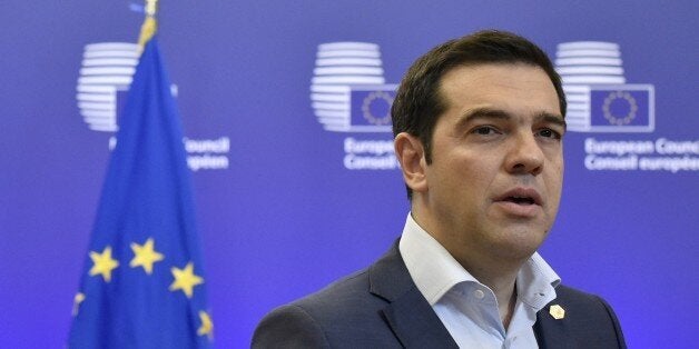 Greek Prime Minister Alexis Tsipras answers journalists' questions after an EU summit at the EU headquarters in Brussels on June 26, 2015. German Chancellor urged Greeceto accept an 'extraordinarily generous' offer from its EU-IMF creditors, which includes at least 12 billion euros ($13.4 billion) in further rescue cash over the next five months. AFP PHOTO/ JOHN THYS (Photo credit should read JOHN THYS/AFP/Getty Images)