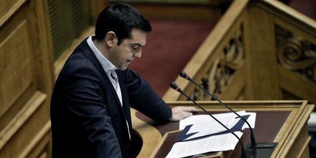 Greek Prime Minister Alexis Tsipras delivers a speech during a parliamentary session in Athens on June 28, 2015. Greece will