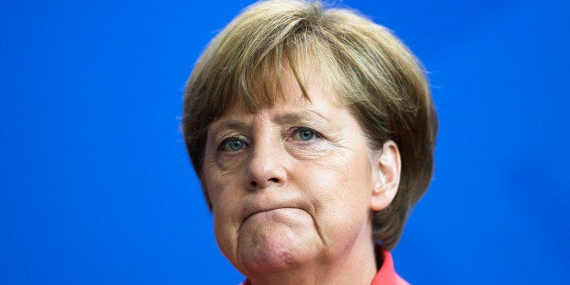 German Chancellor Angela Merkel briefs the media after a meeting with leaders of all parties represented in the German parliament about the Greece crisis, at the chancellery in Berlin, Monday, June 29, 2015. (AP Photo/Markus Schreiber)