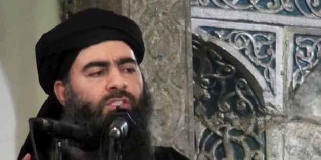 FILE - This file image made from video posted on a militant website Saturday, July 5, 2014, purports to show the leader of th