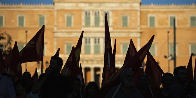ATHENS, GREECE - JULY 02: Greek Communist Party supporters listen to speeches during a rally in Syntagma Square near the Par